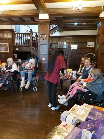Spacious ground floor hall with care team and residents
