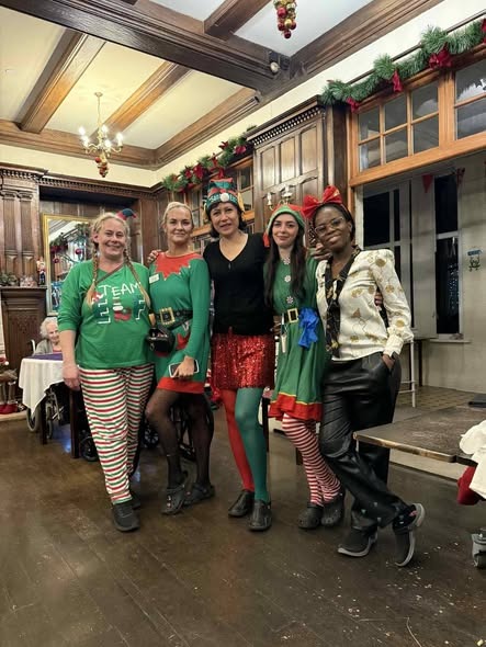 Our cheerful nursing and activities team in holiday attire