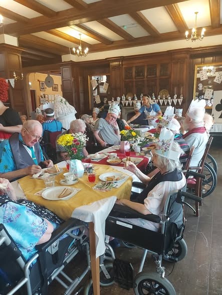 Residents enjoying afternoon tea treats and conversation in Stewton House